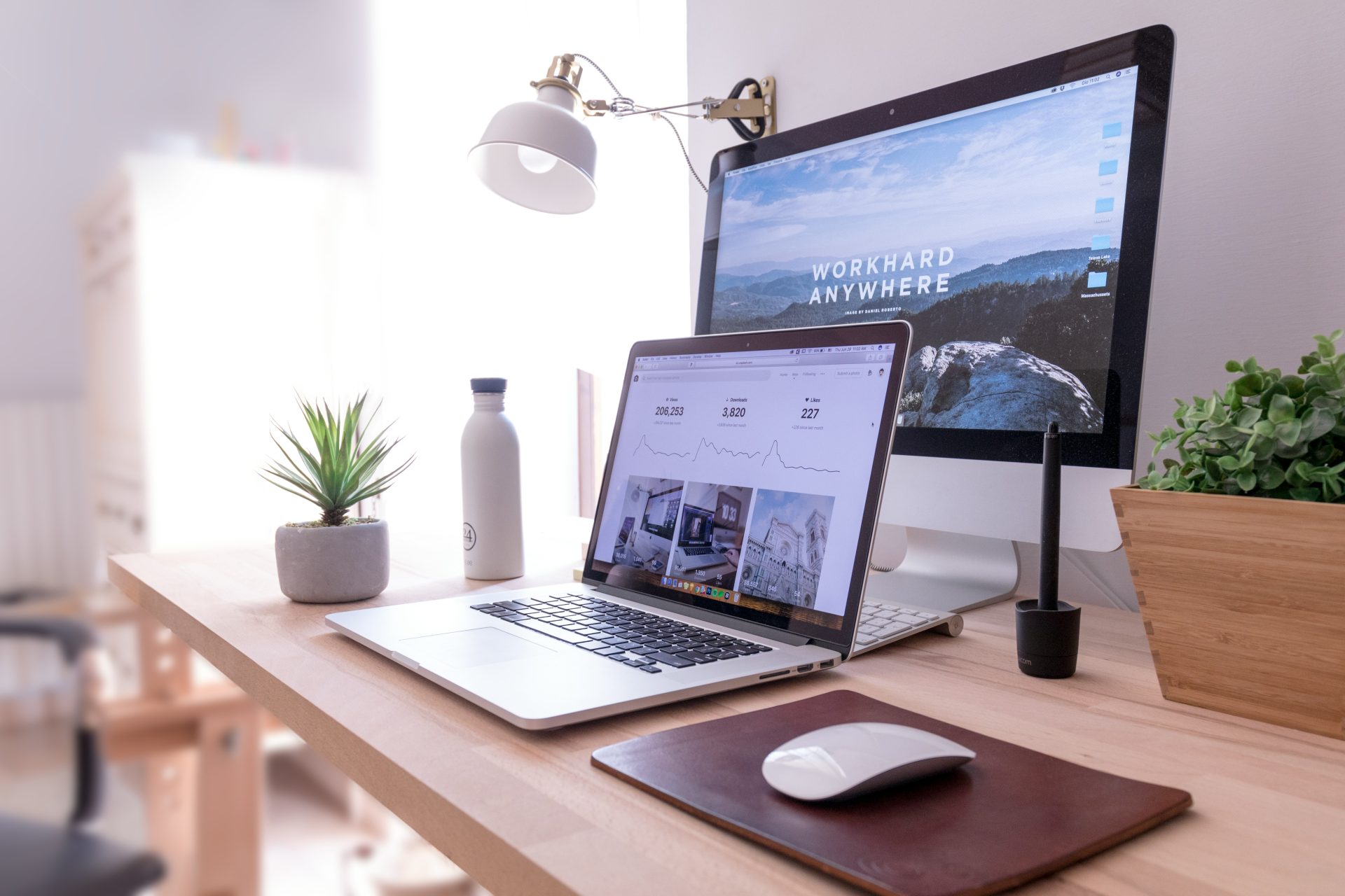 Minimalist desk setup with multiple screens.